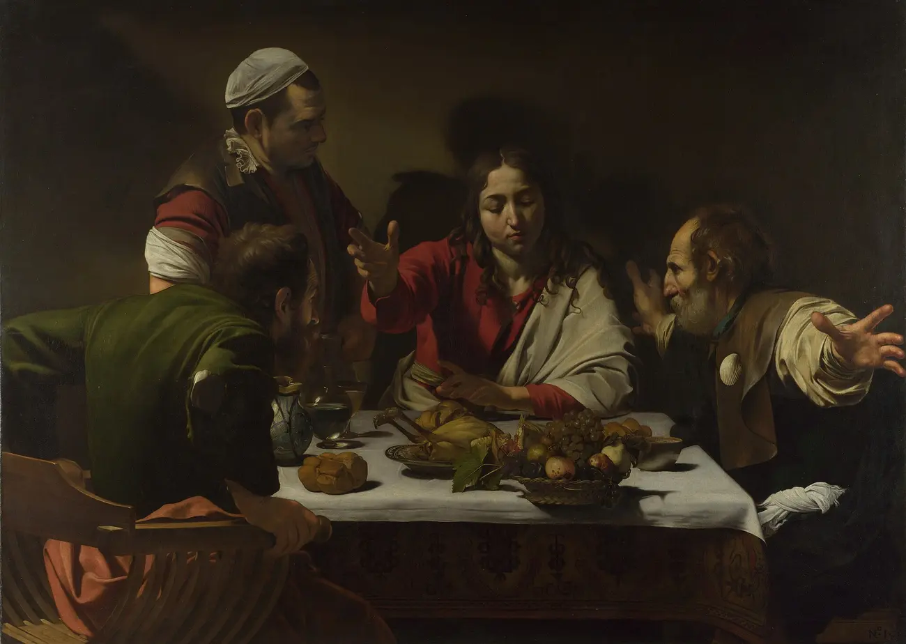 The risen Christ blesses the bread before two disciples at Emmaus