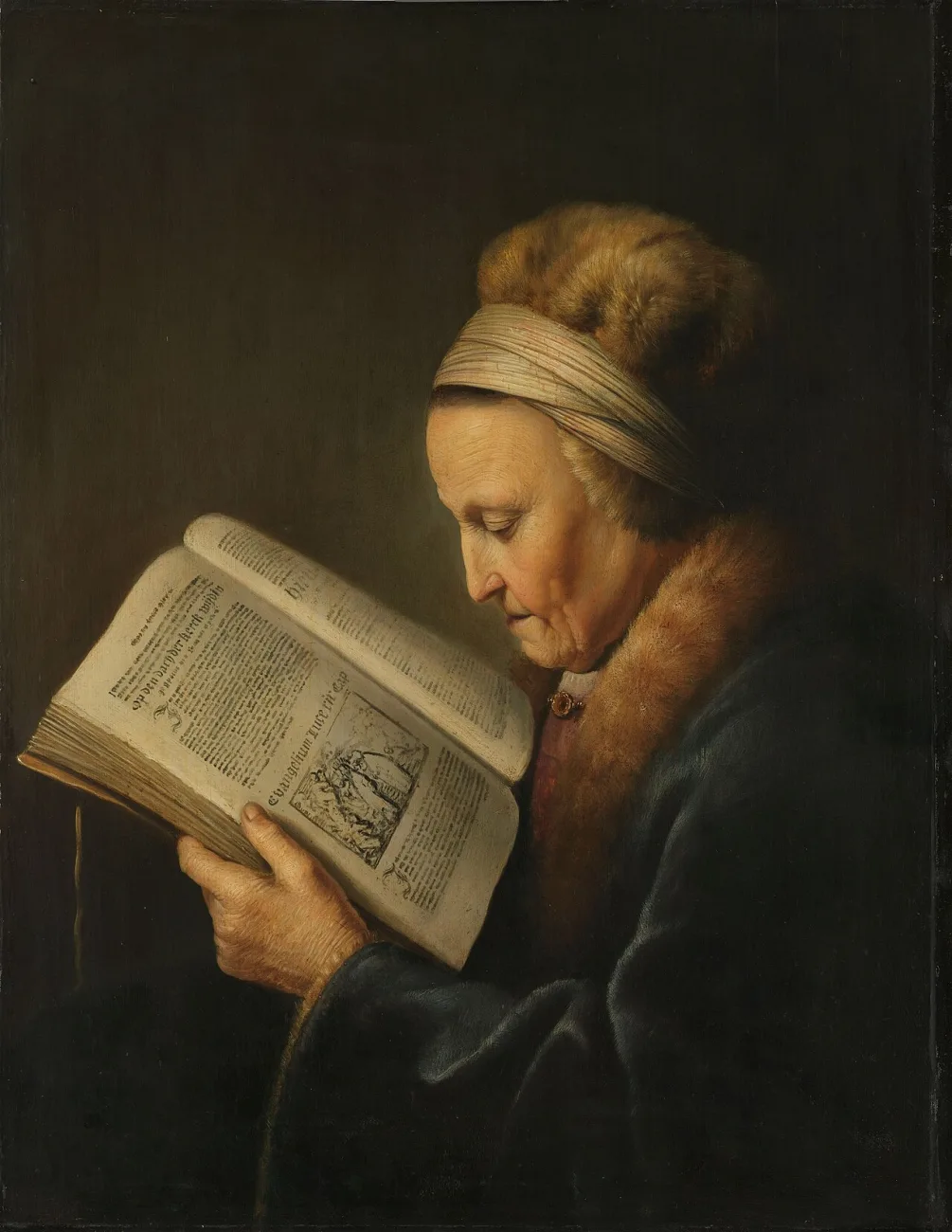 An old woman in a fur-trimmed hood bends close over a great illustrated book